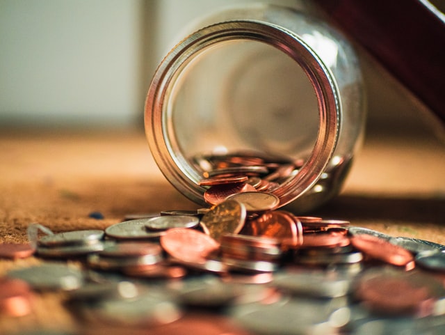 JAR AND SPILLED COINS.