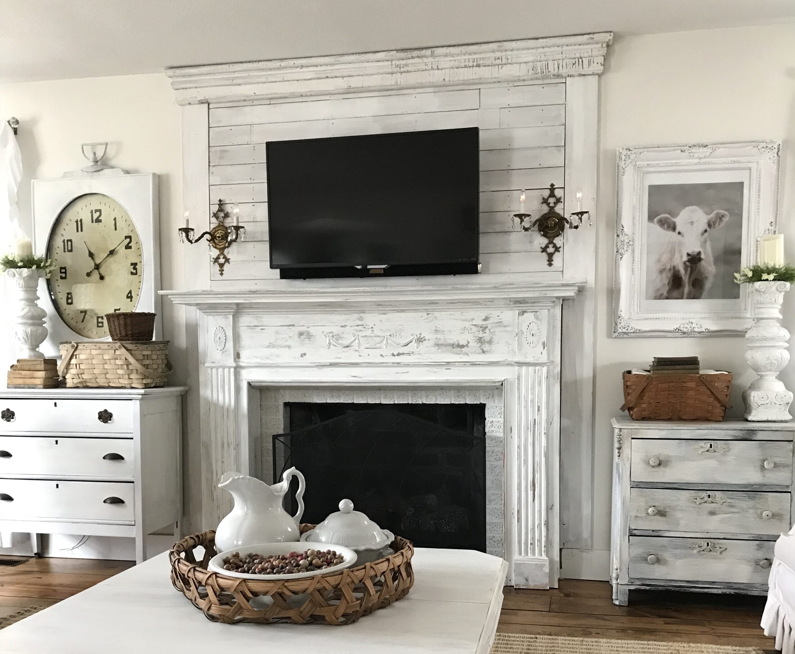 farmhouse fireplace mantel with shiplap white candle holders