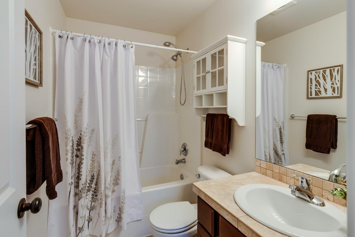A room with lots of trendy bathroom storage hacks included.