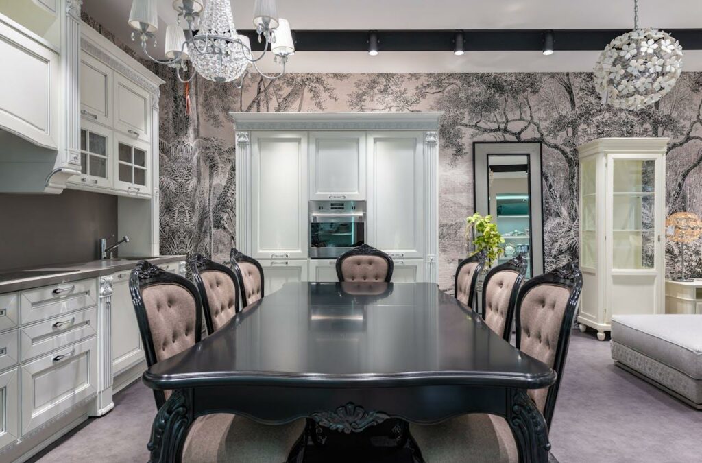 Black table in modern white kitchen.